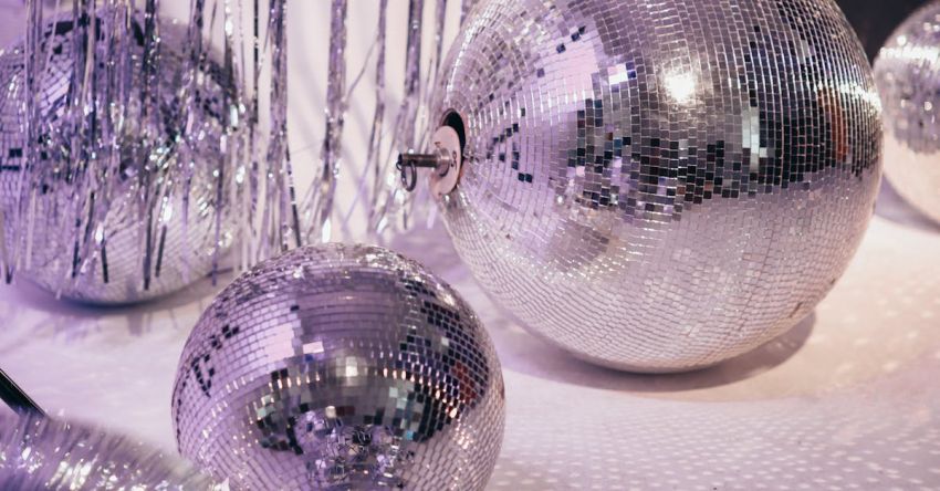 Fashion Icons - Silver and Purple Baubles on White Textile