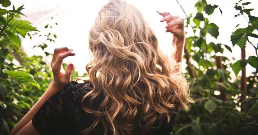 Highlights And Lowlights - Blonde-haired Woman Standing Between Green Plants