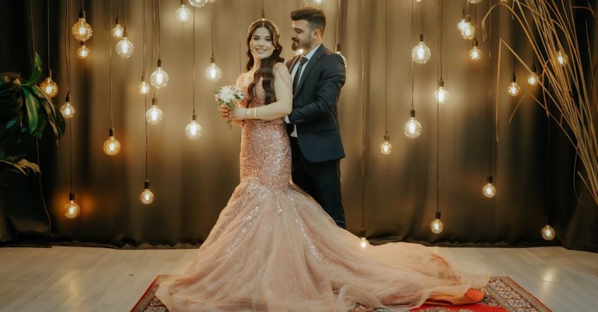 Prom Updos - A bride and groom pose for a photo in front of a rug